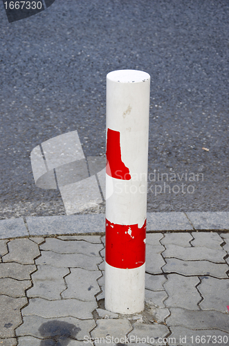 Image of column prevents car to pass road prohibited area. 
