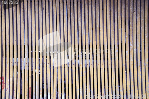 Image of background of arbor fence wall narrow wood planks 