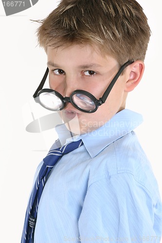 Image of Child looking over top of round glasses