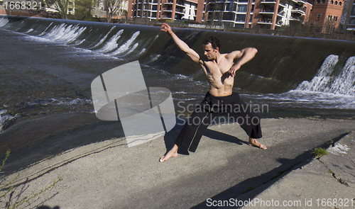 Image of Man practicing martial arts .