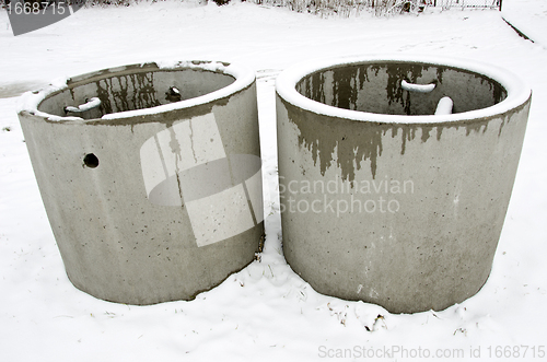 Image of Concrete manholes in winter. waste water treatment 
