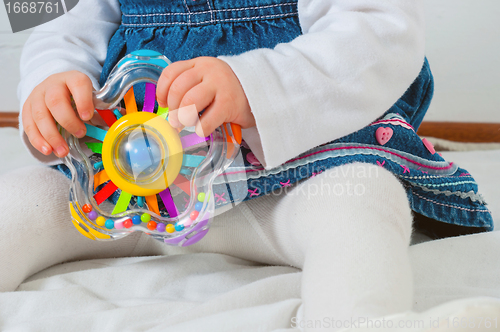 Image of child playing with toy