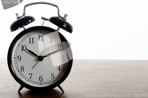 Image of A simple clock against white isolated background