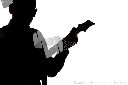 Image of Silhouette of a man with guitar
