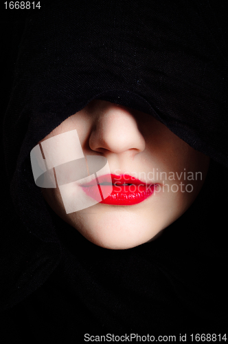 Image of Closeup photo of a woman in black hood and red lips
