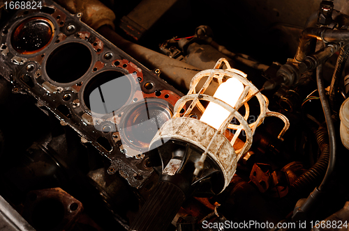 Image of Car motor closeup with old lamp