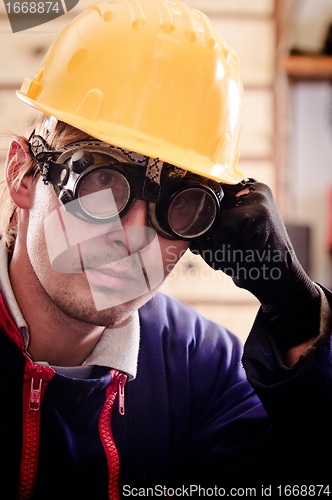 Image of Hard working man in helmet