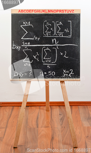 Image of Black chalkboard with formula