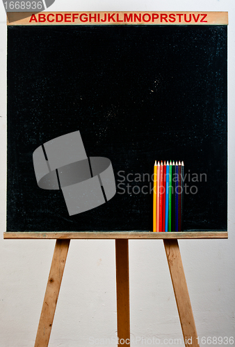 Image of Black chalkboard with pencils
