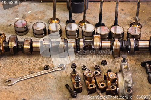 Image of Camshaft of a car on wooden plate