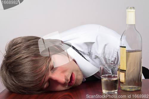 Image of Young man with alcohol