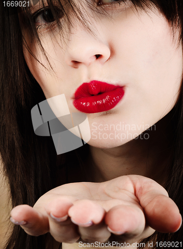 Image of Girl throwing kiss