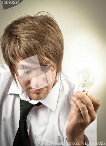 Image of Handsome man and light bulb