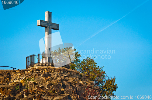 Image of Stone cross at the top of a mountain