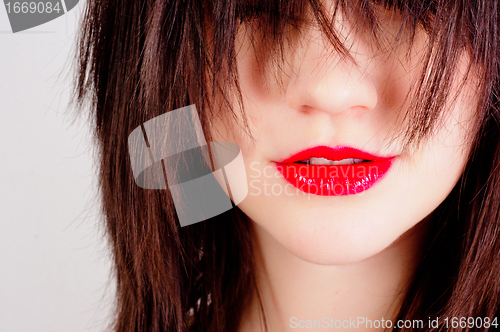 Image of Closeup photo of a woman with red lips