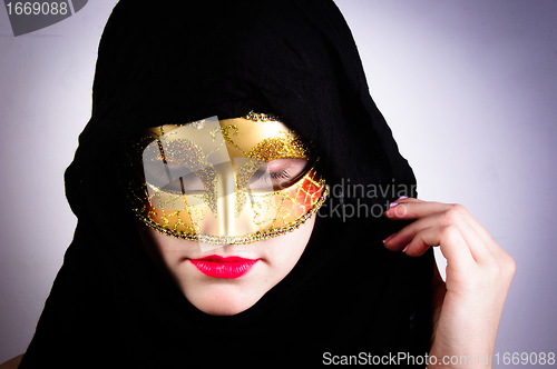 Image of Closeup photo of a woman in black hood and red lips