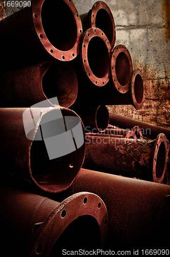 Image of Stack of Rusty pipes 