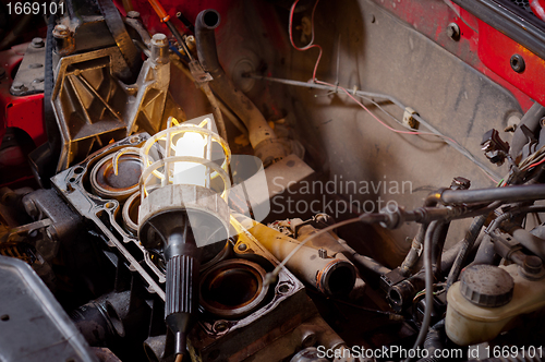 Image of Industrial lamp on old motor block