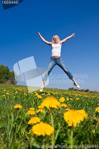Image of happy young woman on meadow