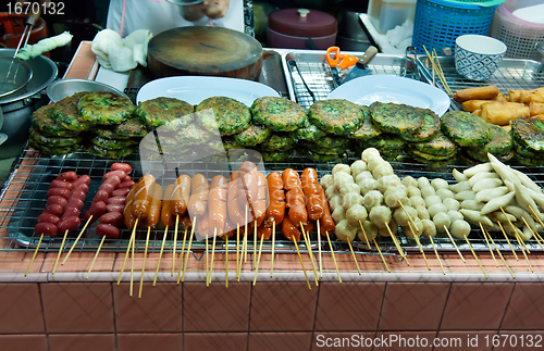 Image of Asian street food tray with skewers