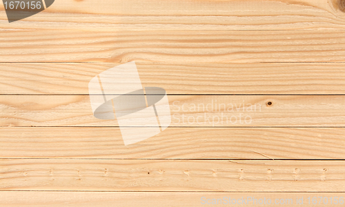 Image of wooden planks laid horizontally, the background