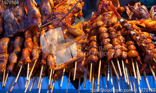 Image of grilled skewers of meat and wings