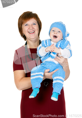 Image of grandmother with her grandson in her arms in the studio