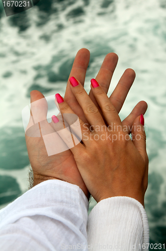 Image of Men's and Women's tanned hands