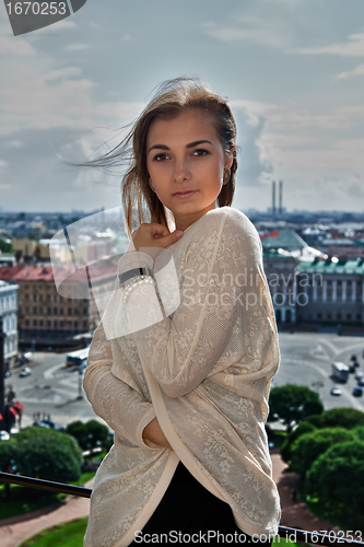 Image of Portrait of a beautiful girl on the roof