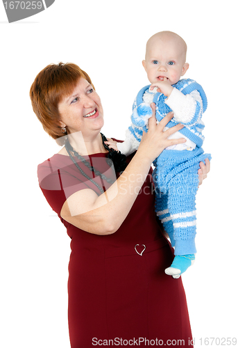 Image of grandmother with her grandson in her arms in the studio