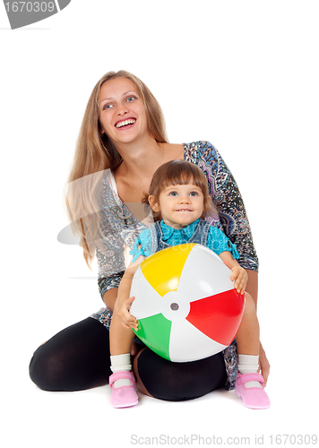 Image of Mother and daughter playing in an inflatable ball