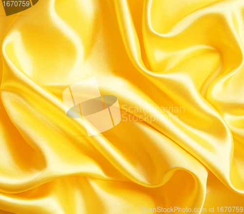 Image of Smooth elegant golden silk as background 