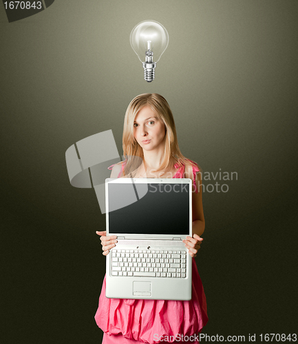 Image of femaile in pink with open laptop