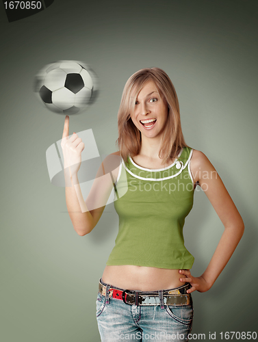 Image of happy girl with soccer ball