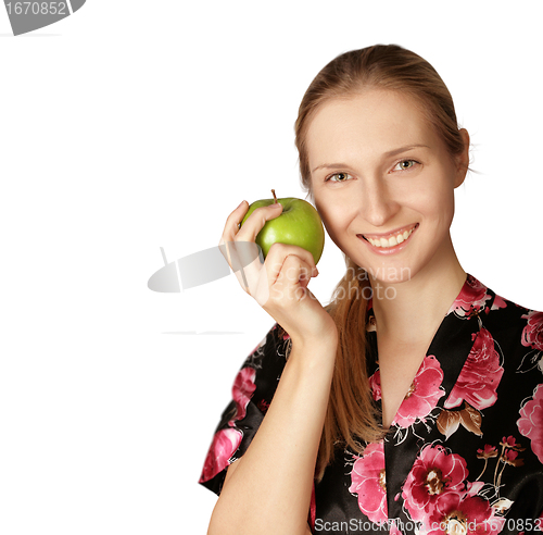 Image of happy woman with agreen apple