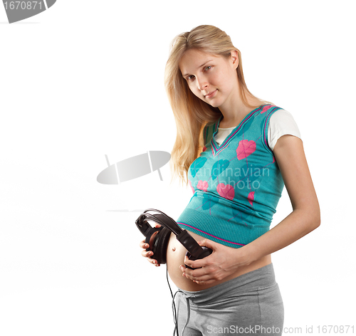 Image of pregnant female with headphones