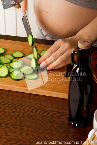 Image of pregnant woman on kitchen