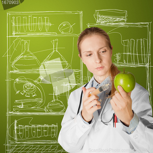 Image of scientist woman with apple