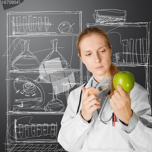 Image of scientist woman with apple