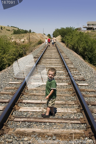 Image of Little Boy on the Train Tracks