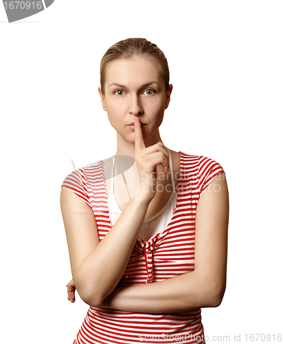 Image of Sporty woman with finger near mouth