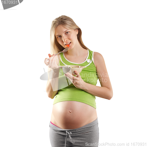 Image of tender pregnant female with salad