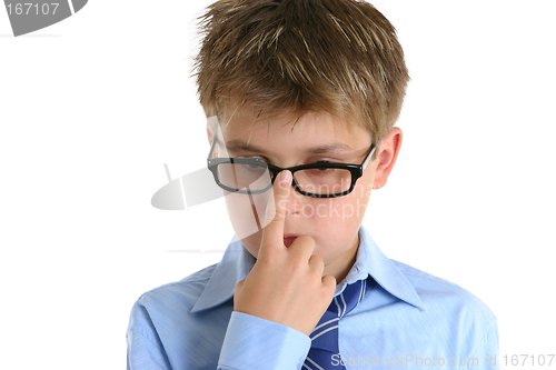 Image of Child pushing glasses up onto nose