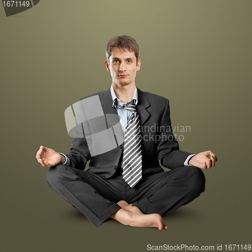 Image of businessman in lotus pose