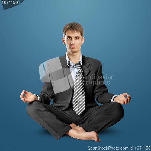 Image of businessman in lotus pose