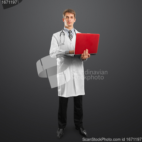 Image of doctor male in suit with laptop in his hands