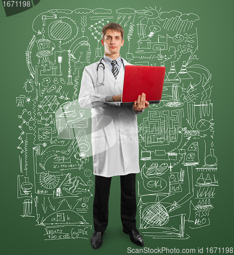 Image of doctor male in suit with laptop in his hands