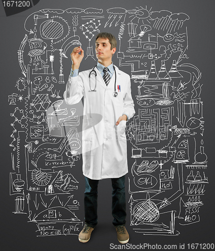 Image of Doctor male writing something 