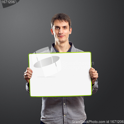 Image of male with write board in his hands