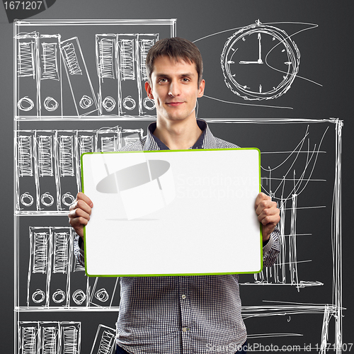 Image of male with write board in his hands